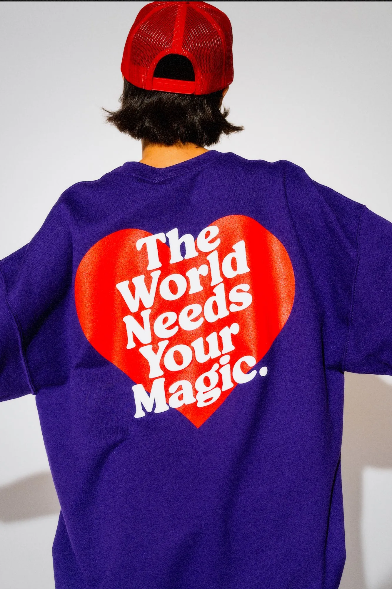 The World Needs Your Magic Heart Puff Print Pullover in Grape Soda